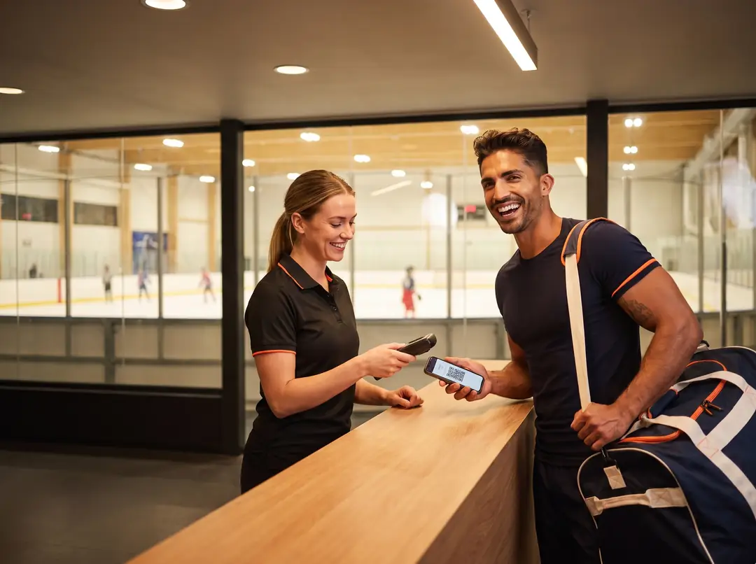 Rec hockey player checking in with a QR code at an ice rink front desk